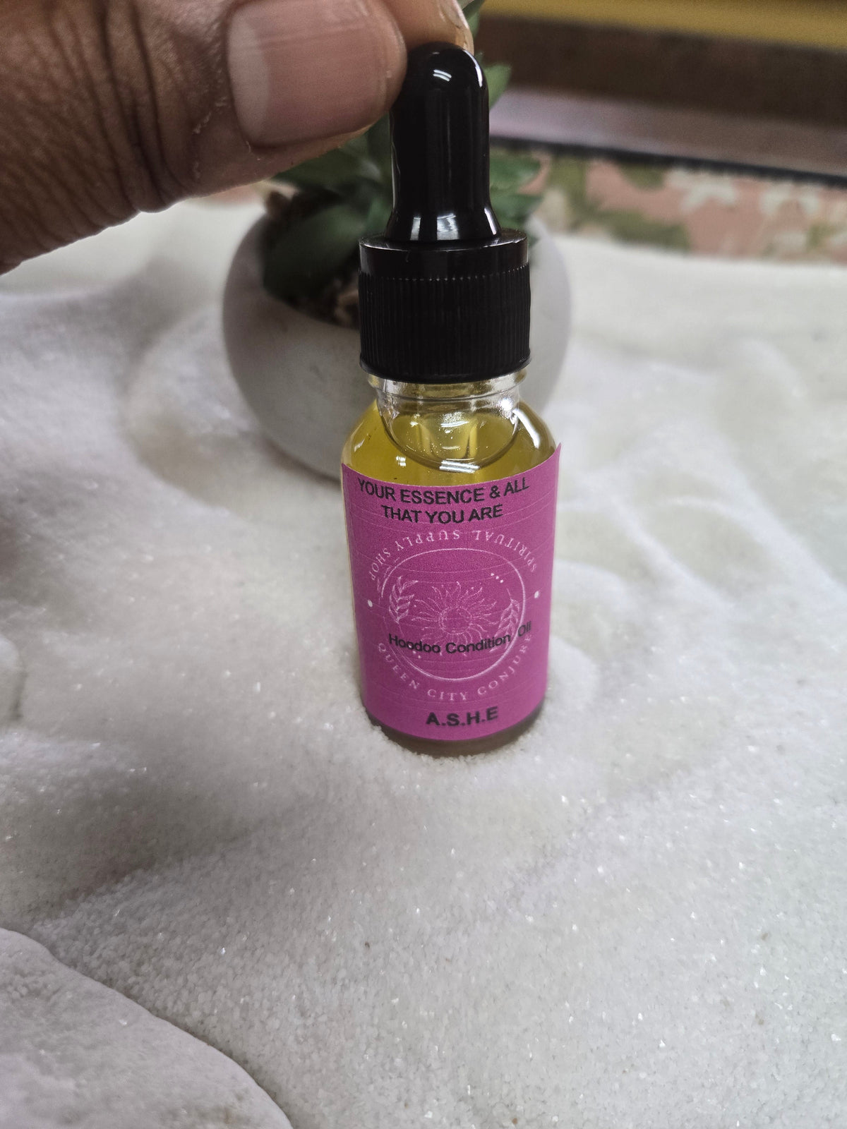 Ashè Spiritual Oil bottle enhancing personal enlightenment and empowerment.