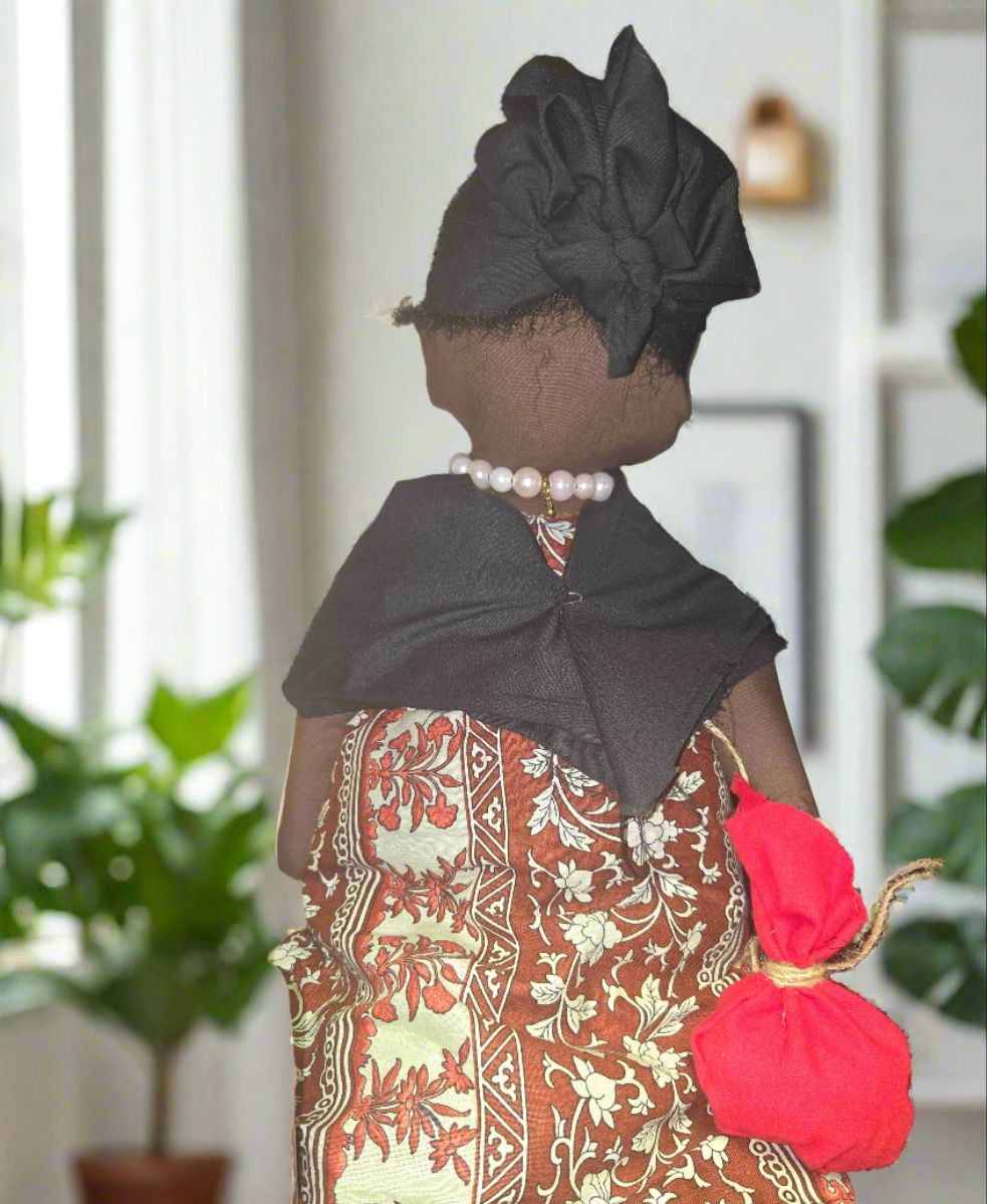 Big Mama ancestor doll representing someone who needs support, focusing on their well-being.