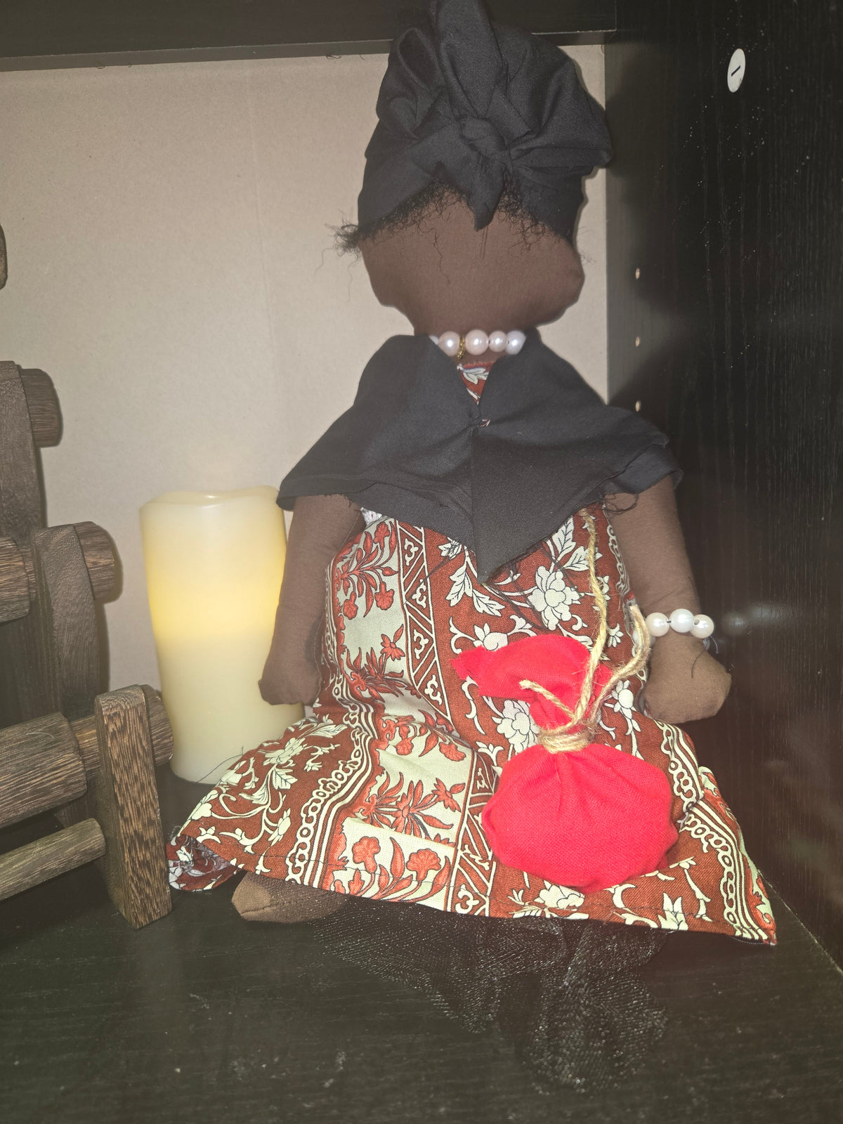 Big Mama ancestor doll representing someone who needs support, focusing on their well-being.