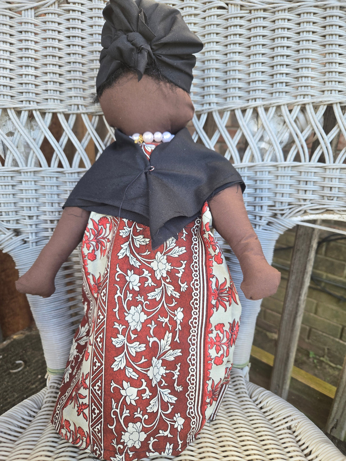 Big Mama ancestor doll representing someone who needs support, focusing on their well-being.
