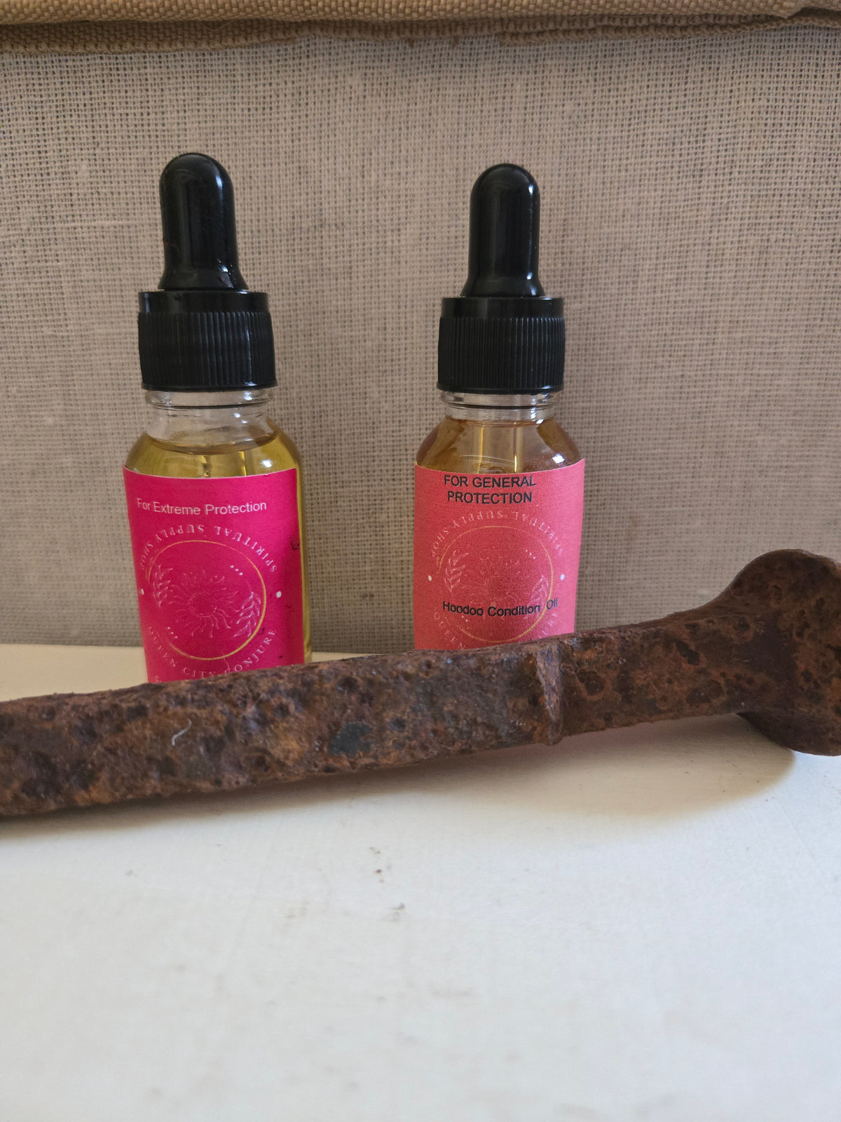 Protection Bundle includes Dragon Blood Protection Oil, Fiery Wall of Protection Oil, sage stick, Protection Mojo Bag and Railroad Spike Queen City Conjure
