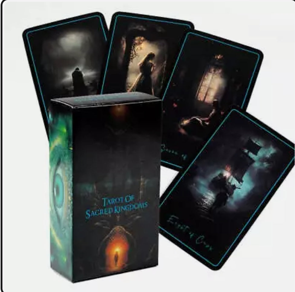 Tarot of Sacred Kingdoms tarot deck with dark-themed illustrated cards and packaging for spiritual divination and energetic resonance.