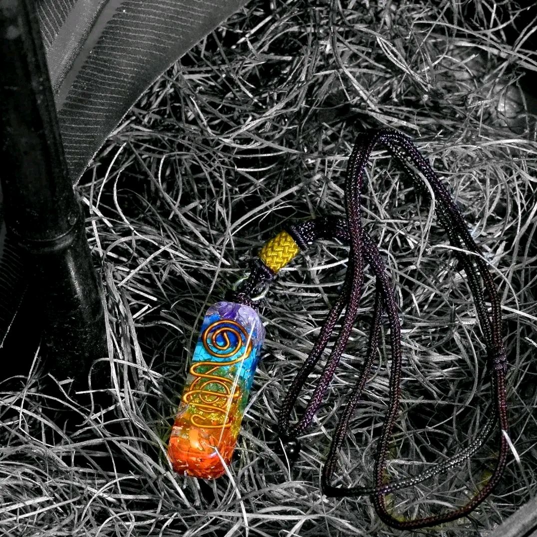 7 Chakra Reiki Stone pendant with fused crystals for meditation and healing.