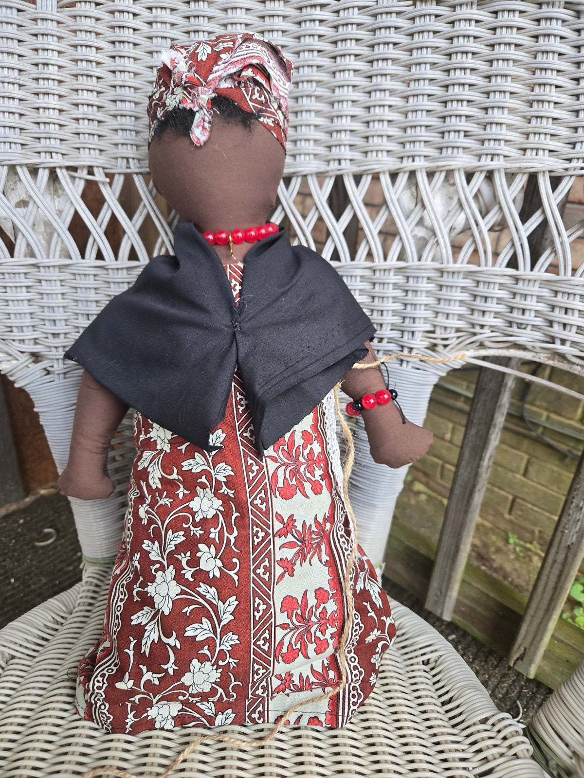 Big Mama ancestor doll  representing someone who needs support, focusing on their well-being.