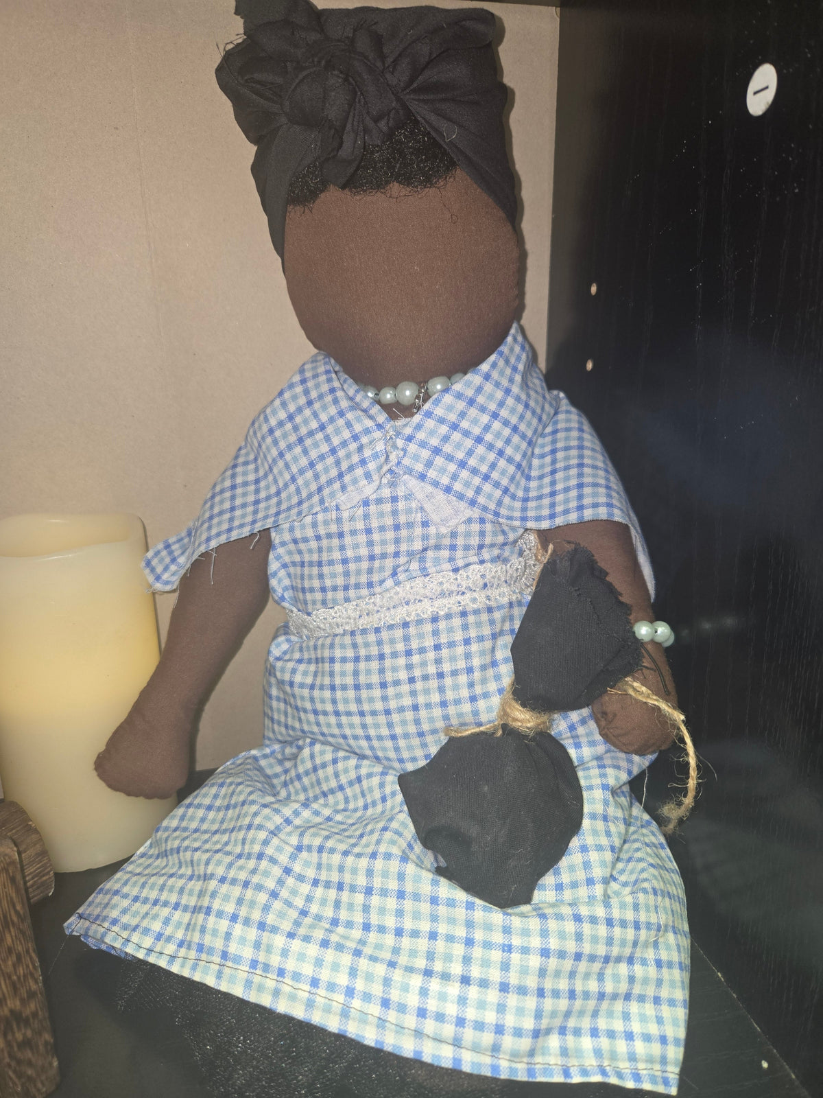 Big Mama ancestor doll  representing someone who needs support, focusing on their well-being.